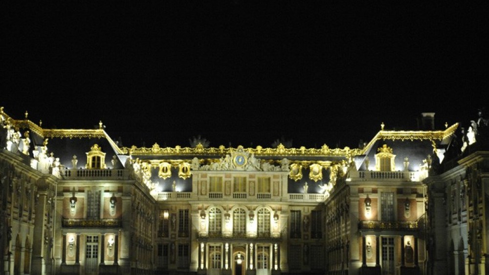 The Château de Versailles by night.