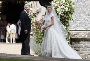 Pippa Middleton wedding Pippa Middleton (in Giles Deacon) arrives with her father Michael Middleton