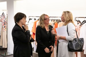 Deirdre Quinn, center, the co-founder and chief executive officer of Lafayette 148 speaks with guests to the store Thursday night during the Unordinary Women event.