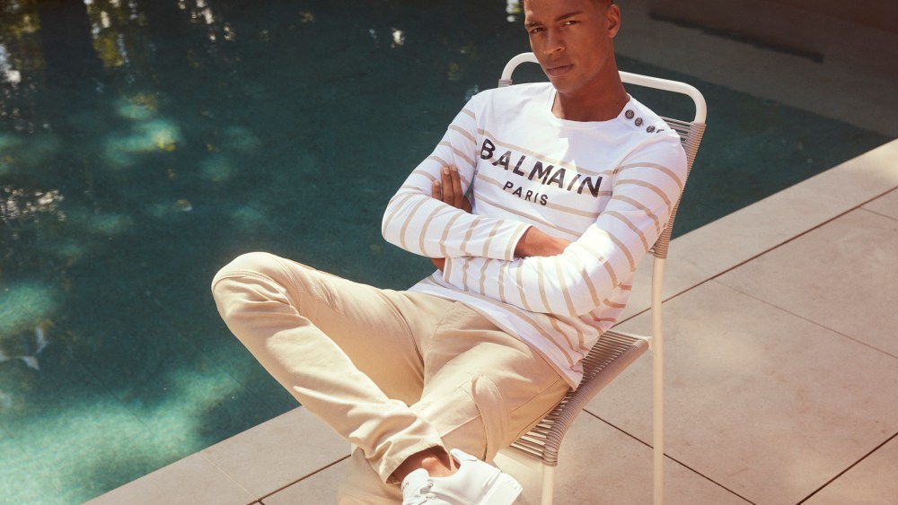 man sitting by pool