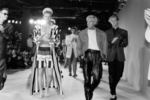 Designer Claude Montana and models walk the runway during his spring 1986 menswear show finale.