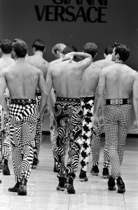 Models walk the show finale in printed denim from Gianni Versace's spring 1992 menswear collection.