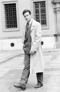 A model poses in an overcoat and double breasted suit from the Ermenegildo Zegna Spring 1991 menswear collection advance.