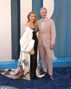 Taika Waititi and Rita Ora at the Vanity Fair Oscar Party held at the Wallis Annenberg Center for the Performing Arts on March 27th, 2022 in Beverly Hills, California.