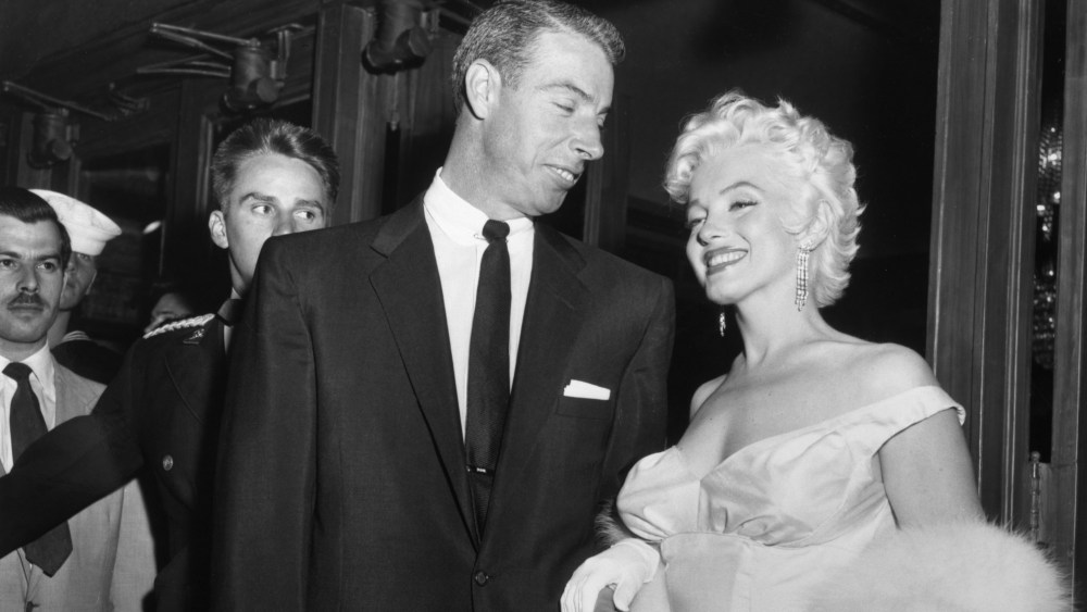 Joe DiMaggio escorts ex-wife Marilyn Monroe to the premiere of her movie The Seven Year Itch