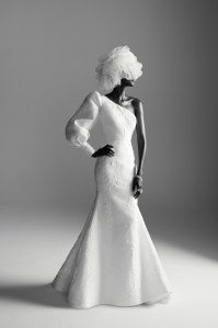 Anne Barge’s floral embossed jacquard trumpet gown. Binata Millinery tulle headpiece; Wempe diamond earrings, diamond chain bracelets and diamond ring; De Beers diamond rings.