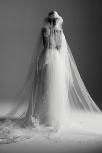 Honor’s shirred tulle gown with Chantilly lace trim bustier. Binata Millinery hat; Anne Barge and Morilee by Madeline Gardner veils; Wempe diamond earrings, diamond chain bracelets and diamond ring; De Beers diamond rings.