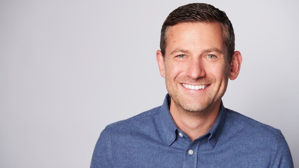 Matt Baer headshot blue shirt