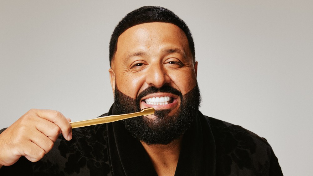 DJ Khaled brushing his teeth with Aurezzi gold toothbrush.