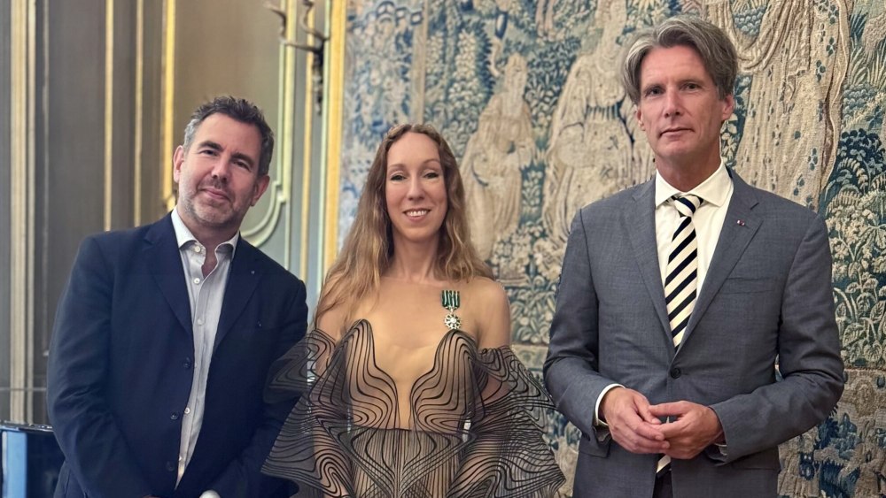 Olivier Gabet and Jan Versteeg look on as Iris Van Herpen is named a Knight of the Order of Arts and Letters