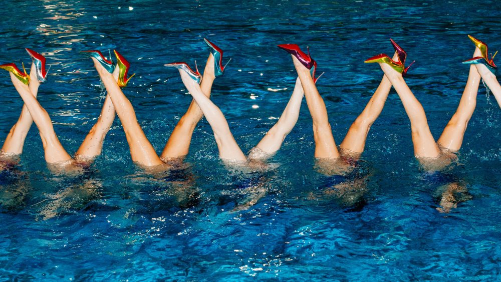 Artistic swimmers from France's national team rehearsing in Christian Louboutin pumps.