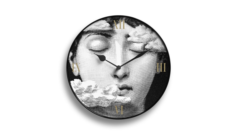 Wall clock from the Fornasetti “Tema e Variazioni" collection.