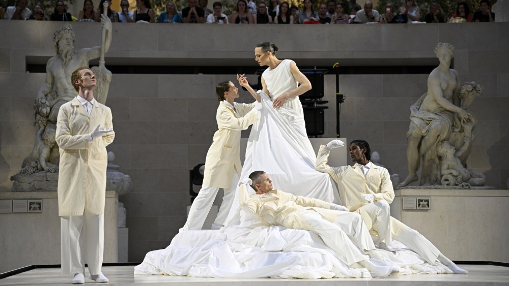 Jordan Roth gives a fashion performance at the Louvre during Paris Couture Week.