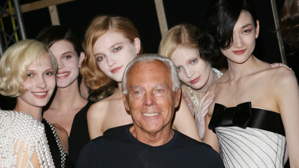 Fashion designer Giorgio Armani (center) and models backstage at Armani's Giorgio Armani Prive fall 2008 haute couture show at the Palais de Chaillot in Paris.