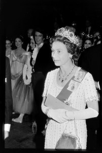 Queen Elizabeth II of England in a Hardy Aimes gown attend her silver jubilee gala at Covent Garden in London, England, on June 2, 1977.