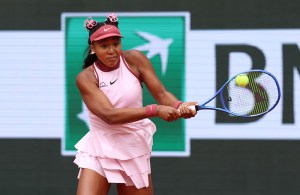 PARIS, FRANCE - MAY 26: Naomi Osaka of Japan plays a backhand against Paula Badosa of Spain during the Women's Singles First Round match on Day Two of the 2025 French Open at Roland Garros on May 26, 2025 in Paris, France. (Photo by Julian Finney/Getty Images)