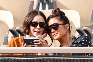 PARIS, FRANCE - MAY 31: Lily Collins and Ashley Park attend Day Eight of the 2026 French Open on May 31, 2026 in Paris, France. (Photo by Stephane Cardinale - Corbis/Corbis via Getty Images)